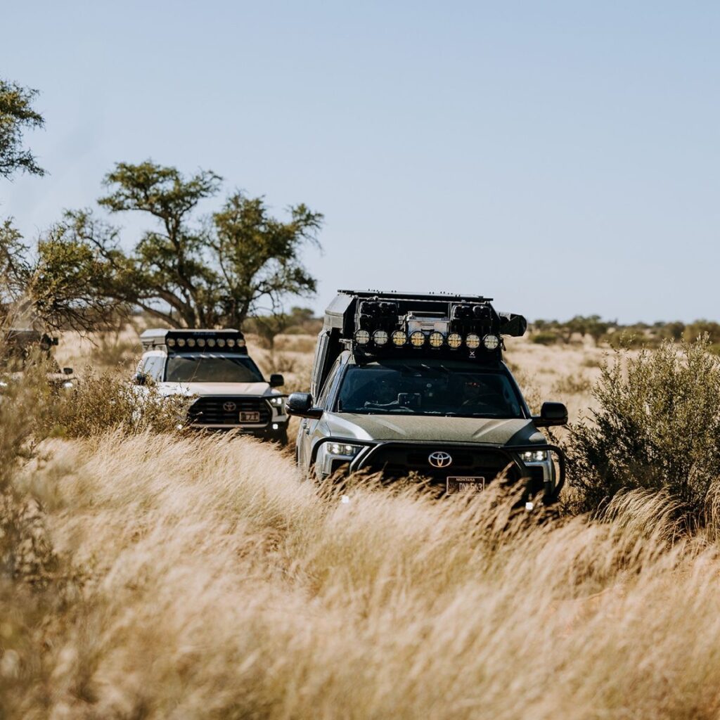 Overland vehicle with RIGID 360-Series round lights on the roof rack